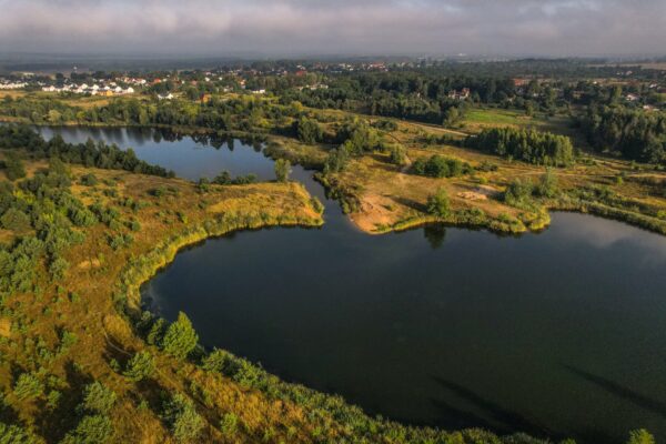 aerial view of a countryside lake at summer dusk